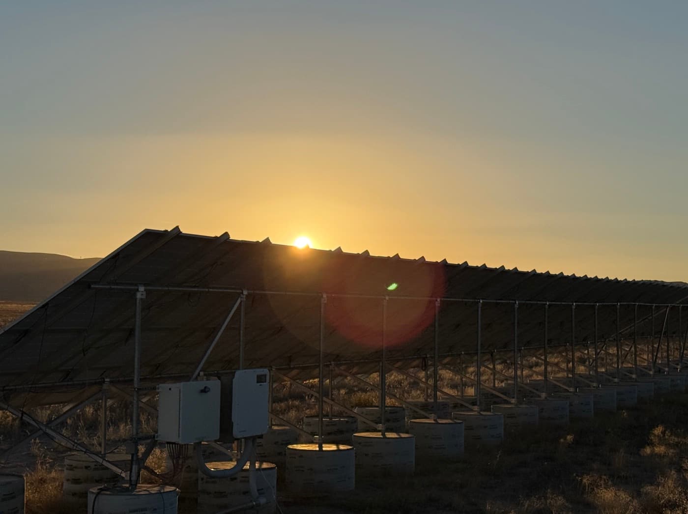 Solar tracker array at sunset at the Clutch off grid mining operation in Delta, Utah